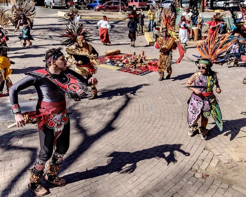 Native American dancers perform on the plaza in Taos, New Mexico.