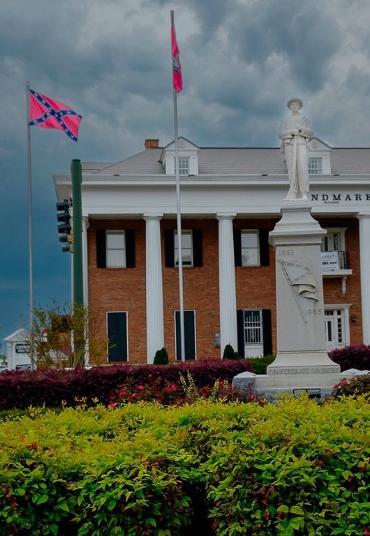 More than 150 years after the end of the U.S. Civil War, a Confederate battle flag flies over a public square in downtown Hot Springs, Arkansas