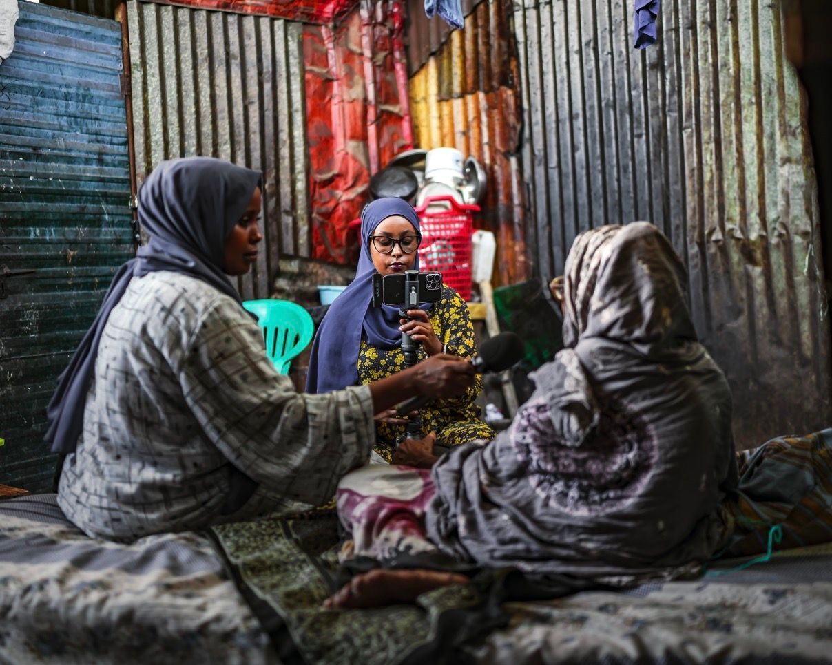 Reporters from Bilan conduct an interview with another woman in Somalia.