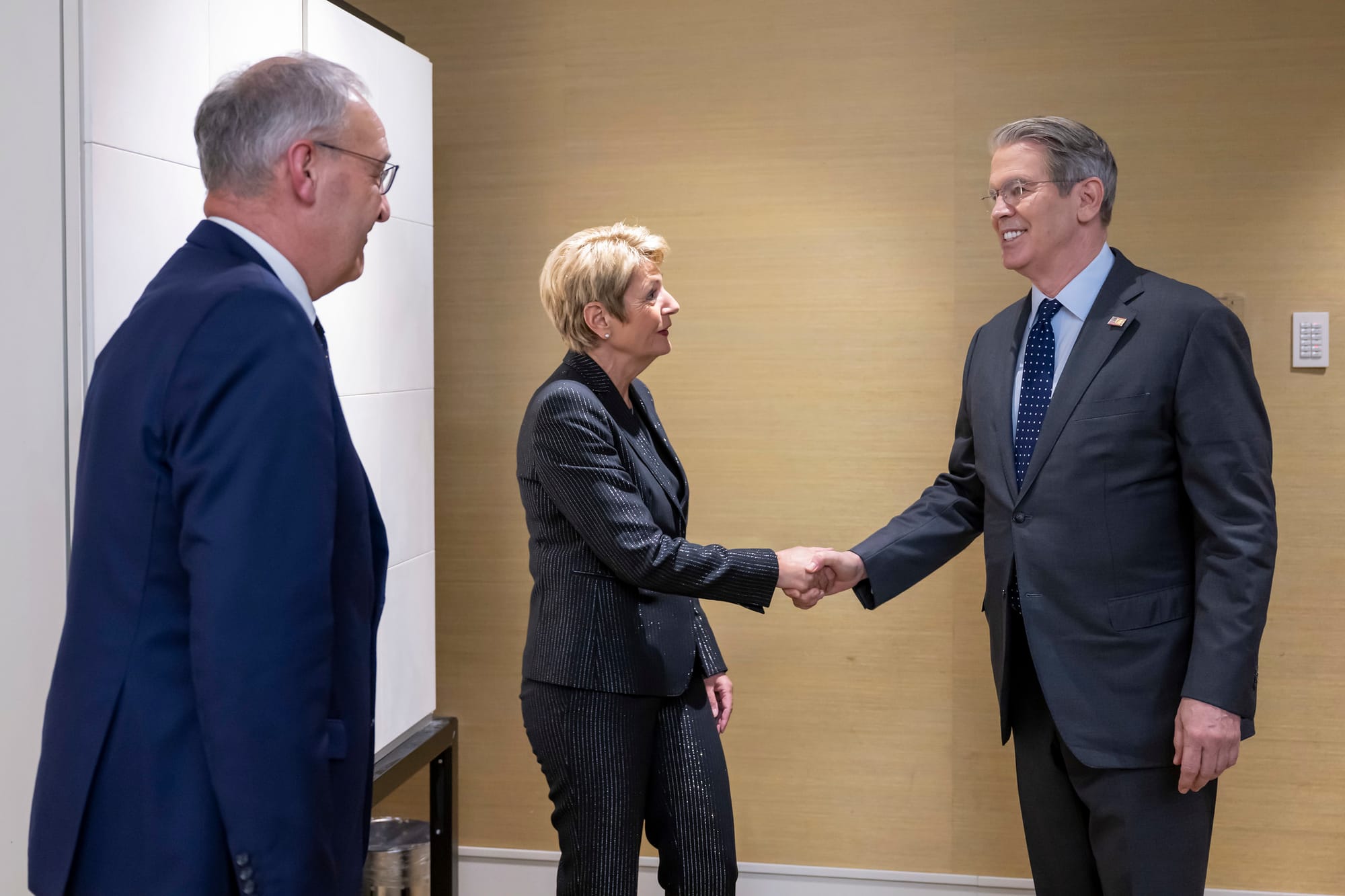 Swiss Economics Minister Guy Parmelin, left, looks on as Swiss President Karin Keller-Sutter shakes hands with U.S. Treasury Secretary Scott Bessent at a meeting in Geneva.