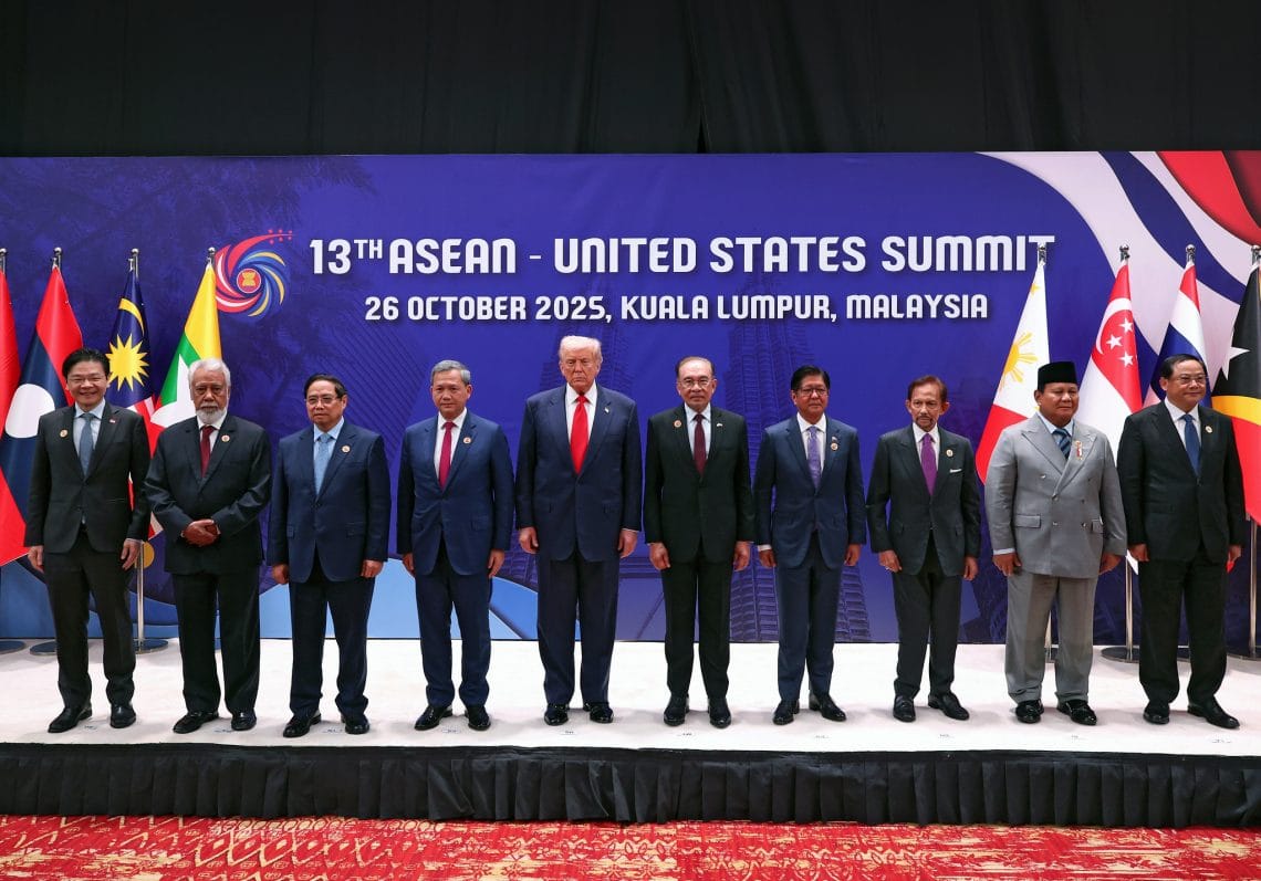 ASEAN leaders flank U.S. President Donald Trump for a group photo in Malaysia.
