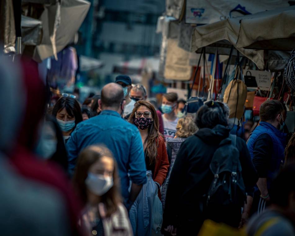 People at a local market in Milan, Italy, during the COVID-19 pandemic