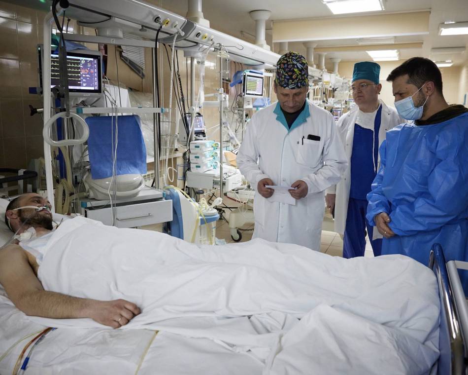 Ukraine's President Volodymyr Zelenskyy visits a soldier at a military hospital in March