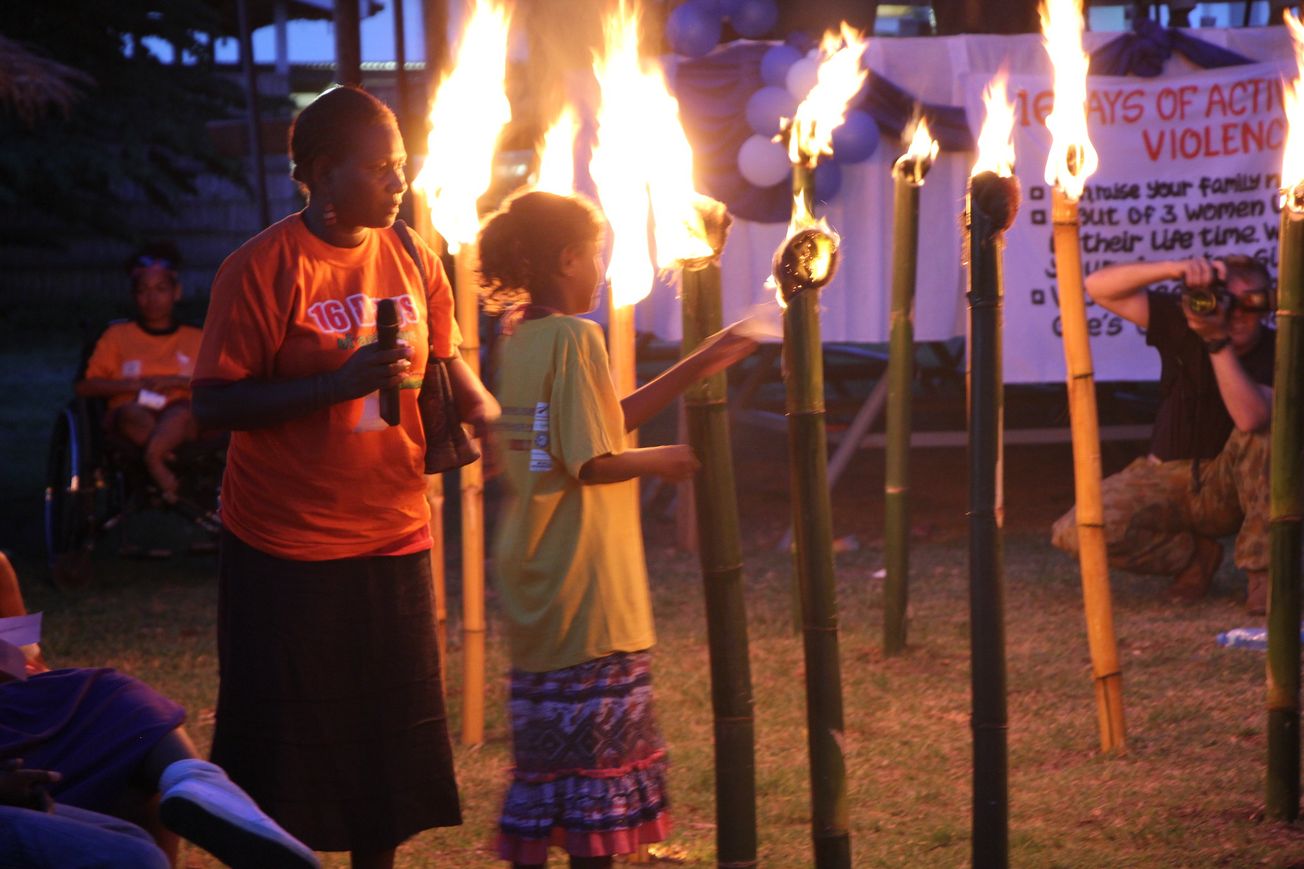 Women light 16 symbolic candles in the Solomon Islands