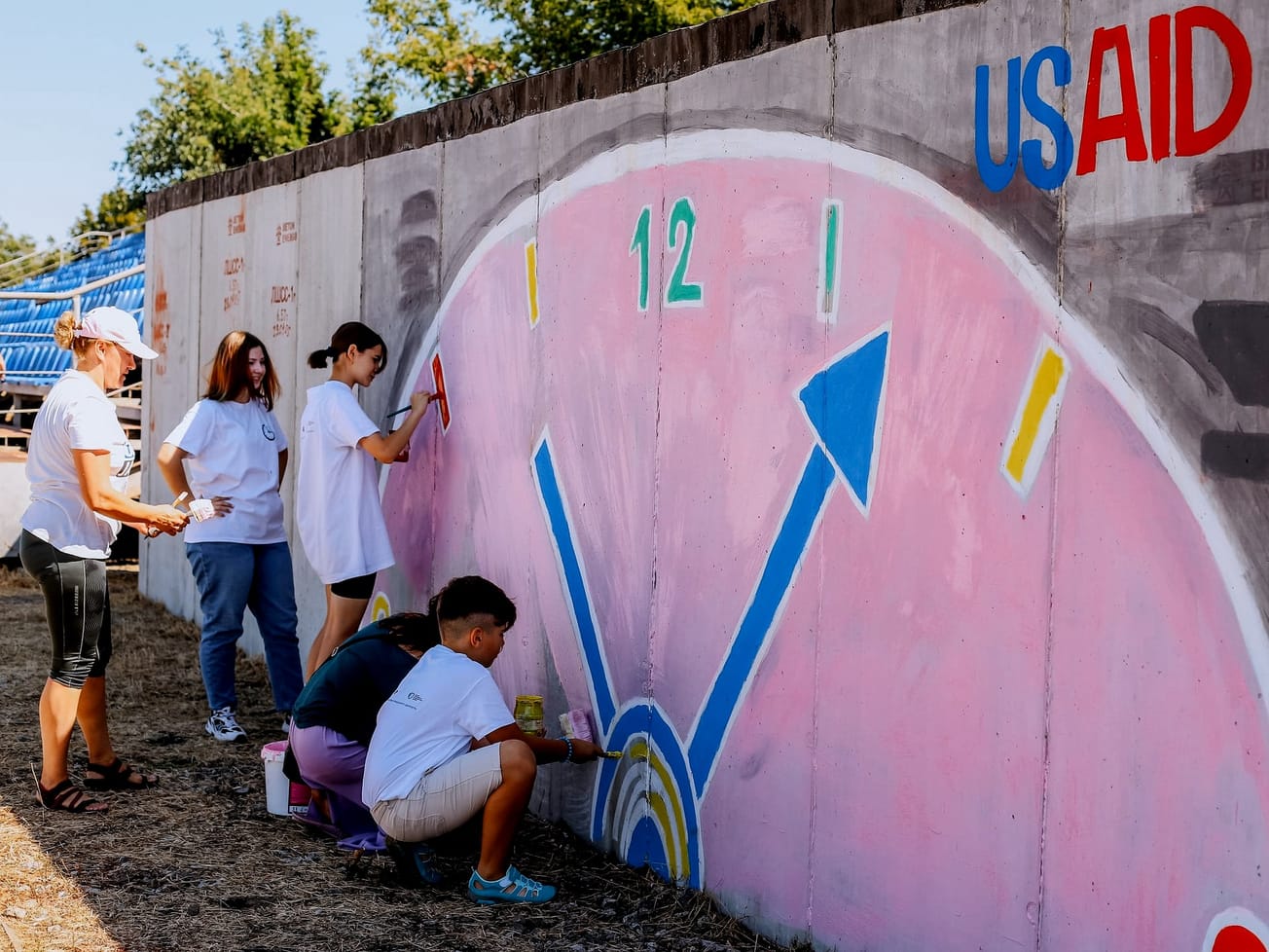 Residents in the Odesa region of Ukraine create a mural on the wall of a bomb shelter.