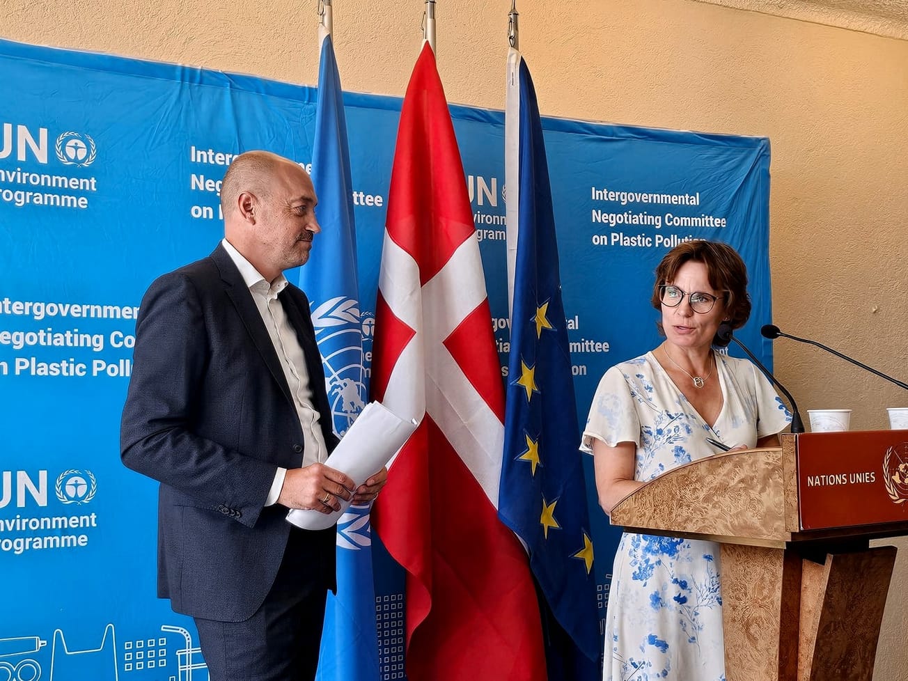 European Commissioner Jessika Roswall speaks to reporters inside the U.N.'s Palais des Nations alongside Danish Environment Minister Magnus Heunick.