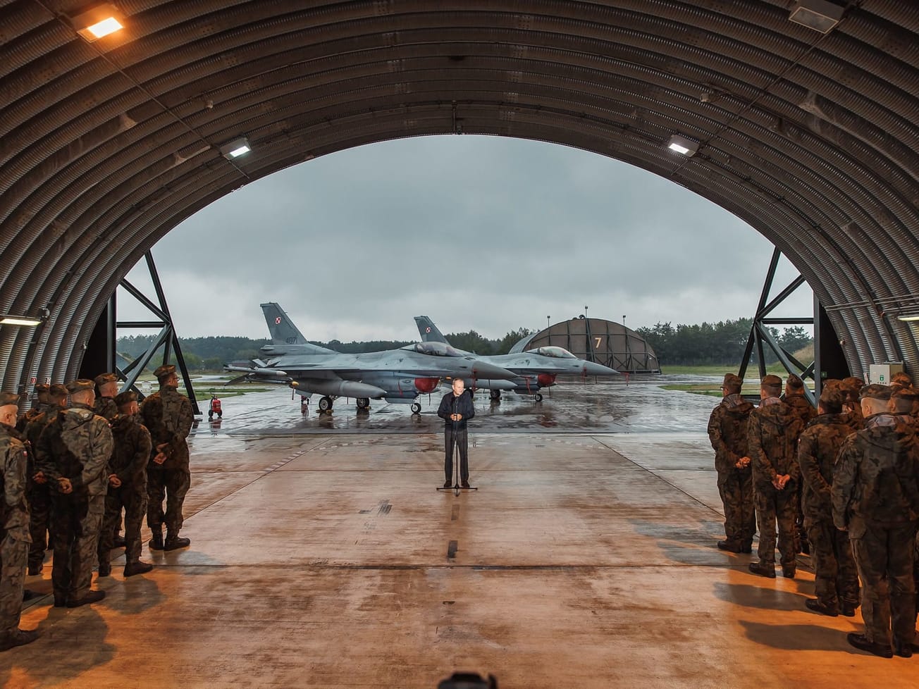 Polish Prime Minister Donald Tusk meets air force personnel at the 32nd Tactical Air Base in Lask, Poland a day after the drone incident.