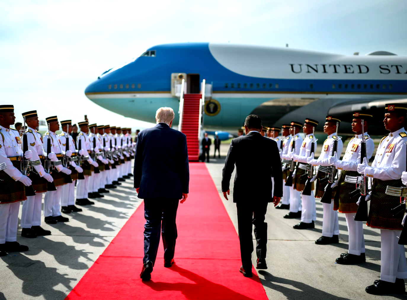 U.S. President Donald Trump and Malaysian Home Affairs Minister Datuk Seri Saifuddin Nasution Ismail, walk the tarmac after the ASEAN Summit at Kuala Lumpur in October.