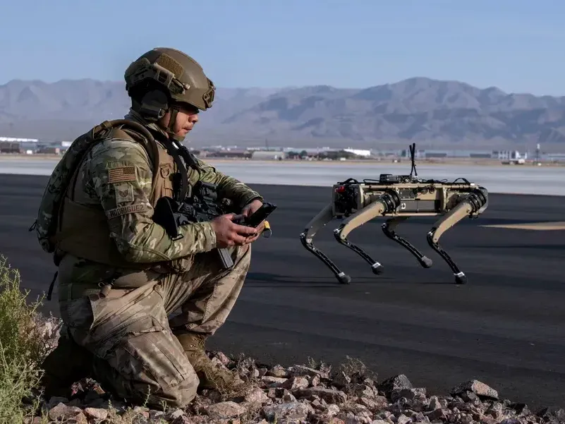 A U.S. Air Force technical sergeant uses a robot equipped with advanced sensors, including thermal and infrared video, combined with AI.