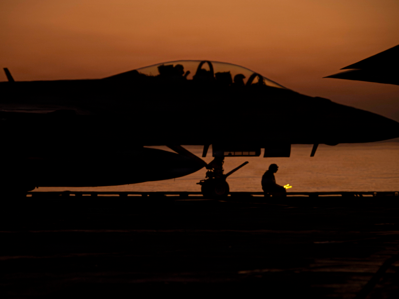 A Navy F/A-18E Super Hornet prepares to launch from the flight deck of the USS Abraham Lincoln in the Arabian Sea in mid-February. 