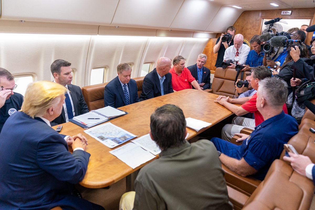 U.S. President Donald Trump holds a briefing on Hurricane Dorian aboard Air Force One on September 9, 2019
